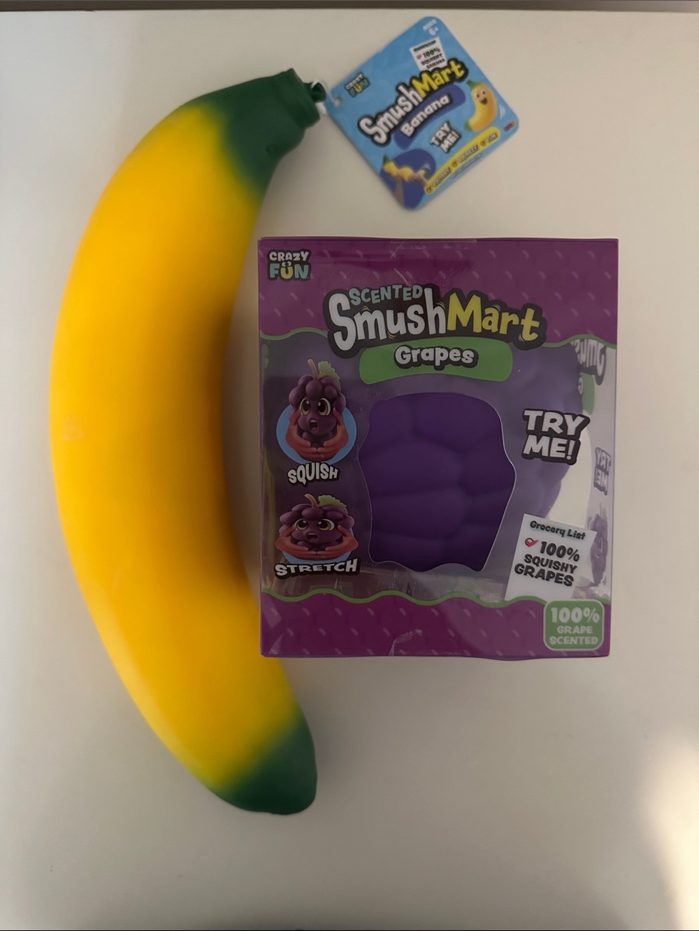 Smushmart Banana Squishy and scented Smushmart Grape